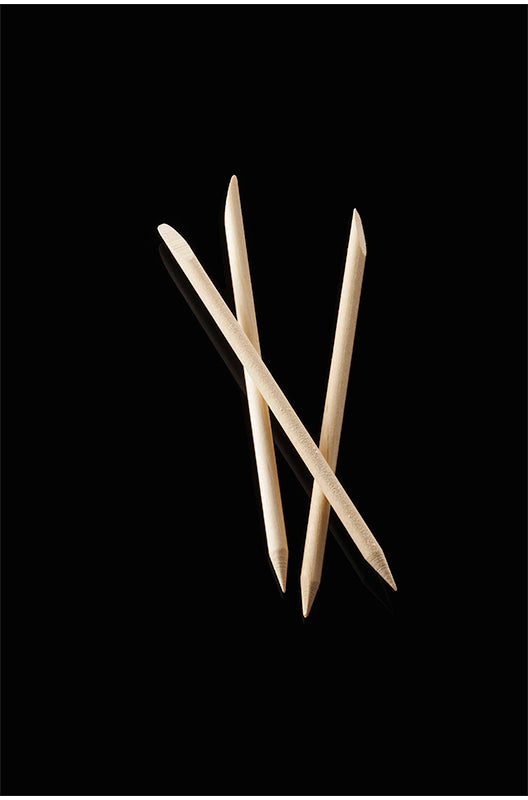 SuperNail Orangewood Sticks with beveled edges in three-dimensional demonstration place in a vertical black rectangular frame