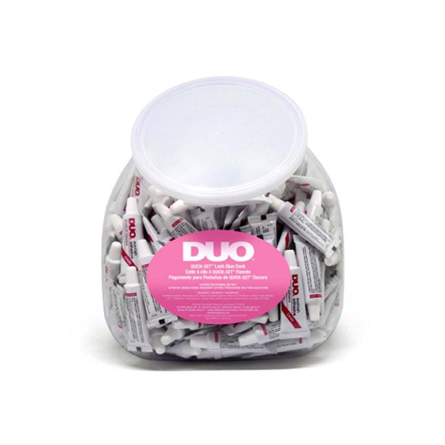 Jar of DUO lash glue sticks with a pink label on a white background