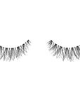 A single pair of Ardell Baby Wispies showing its elongated lash in the center with shorter inner and outer corners