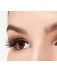 A model wearing Ardell Double Wispies in a side view showing its curly & long length lashes