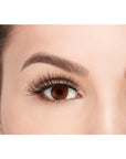 A model with an open right eye wearing Ardel Double Wispies showing how it looks like when wearing
