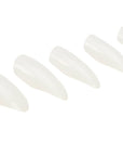 A set of Ardell Nail Addict Premium Artificial Nail with Clear Natural color in stiletto shape laid down in 45 degree angle