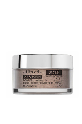 A transparent 2 ounce glass tub containing ibd Dip & Sculpt Sparkling Embers nail dip powder