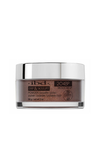 Front-facing 2 ounces clear glass container of ibd Dip & Sculpt Bronze Me Up printed with product details