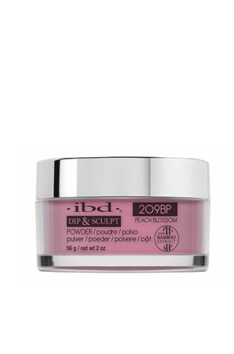 A clear 2 ounce glass jar filled with ibd Dip & Sculpt Peach Blossom nail powder dip capped with a metallic silver cover