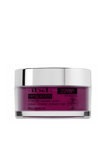 Transparent 2 ounce glass container of ibd Dip & Sculpt Pep Squad nail powder printed with product name & details