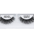A single pair of Ardell Double Up Demi Wispies placed into its retail wall hook with some texts written on it