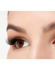An extreme side close up shot of an eye wearing a Fauxmink 811 by Ardell creating a natural eyelash look