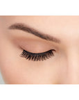 A model wearing Ardell's Faux mink 812 with close right eye showing its medium volume & long length, rounded lash