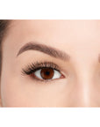 A model with opened eye wearing Ardell Fauxmink Demi Wispies showing how it looks like when worn on a frontal view
