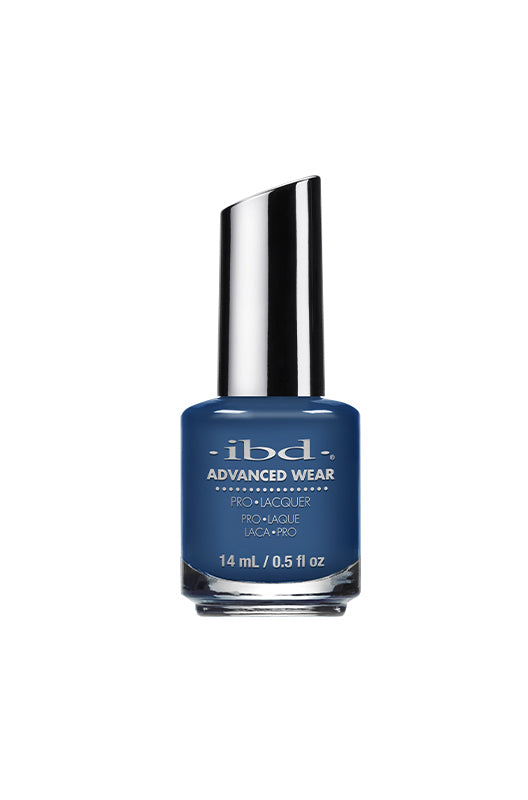 IBD Advanced Wear Lacquer in "Blue Me a Beso," a muted blue nail polish with a sophisticated, high-shine finish.