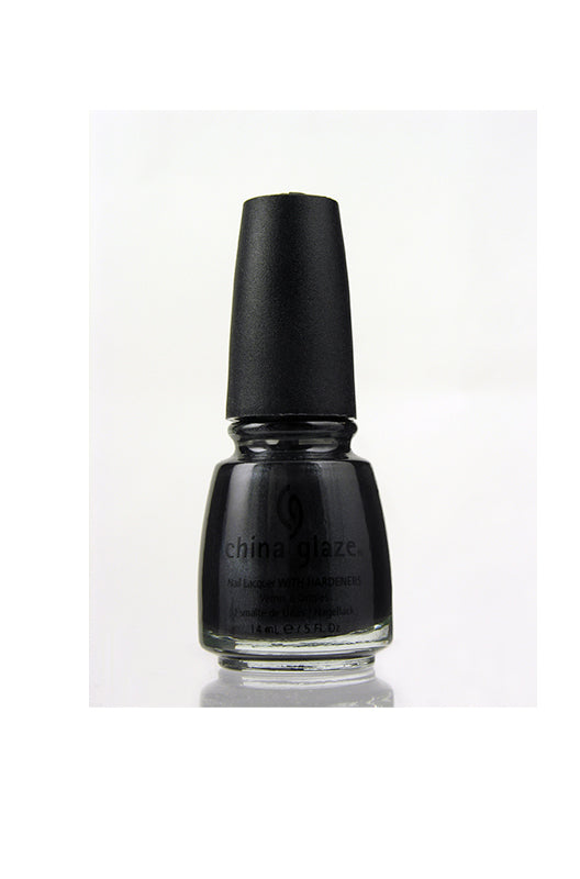 A sphere with black beach sand texture nail polish sample color swatch lay on a plain scene
