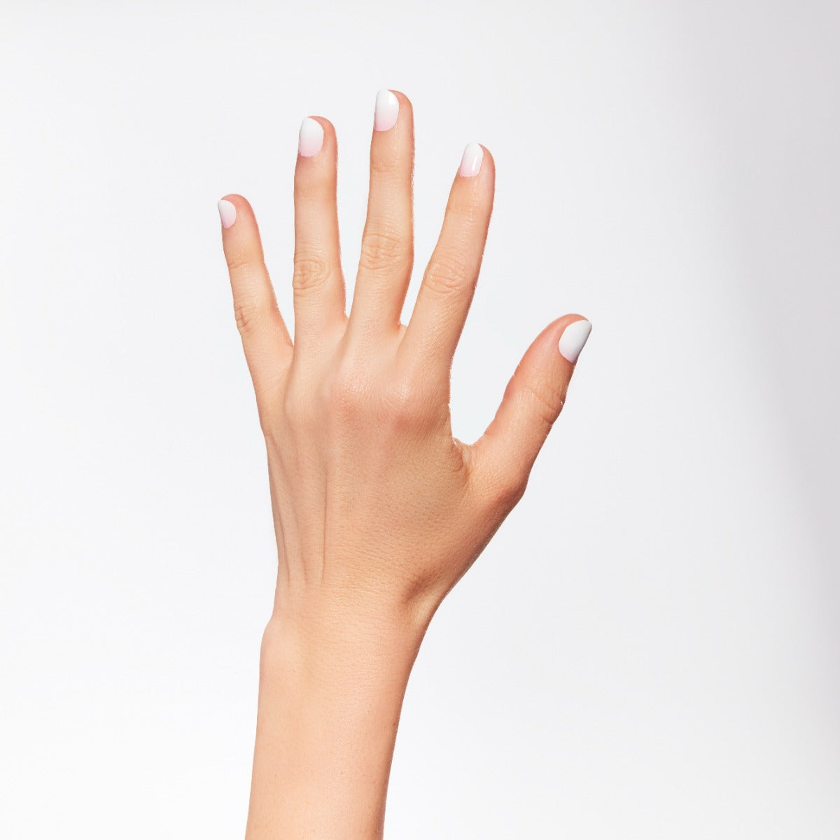 A woman hand using Ardell Nail Addict Gel Nail Strips