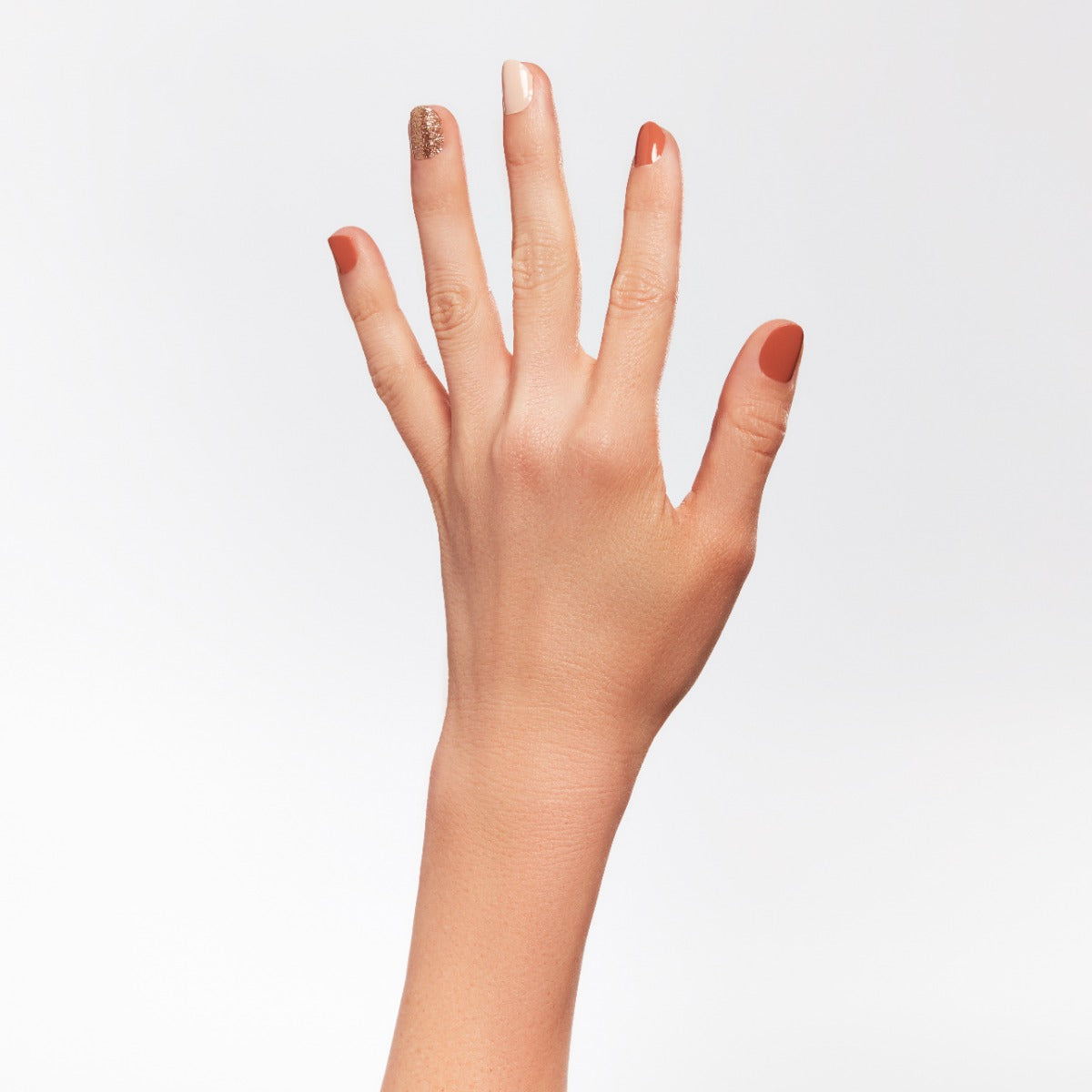 A woman's hand with colorful nail cuticle.