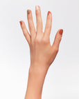 A woman's hand with colorful nail cuticle.
