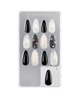 Set of 12 marble & diamond stiletto press-on nails displayed in packaging for a stylish manicure.