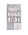 Pack of 12 gilded ombre stiletto press-on nails in clear packaging for a trendy, salon-quality manicure.