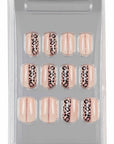 Packaged pink cheetah and glitter striped press-on toenails, delivering a stylish and glamorous nail look.