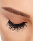 A model wearing Ardell's Double Up 207 with close right eye showing its extra-long layers with intense volume & fullness lash