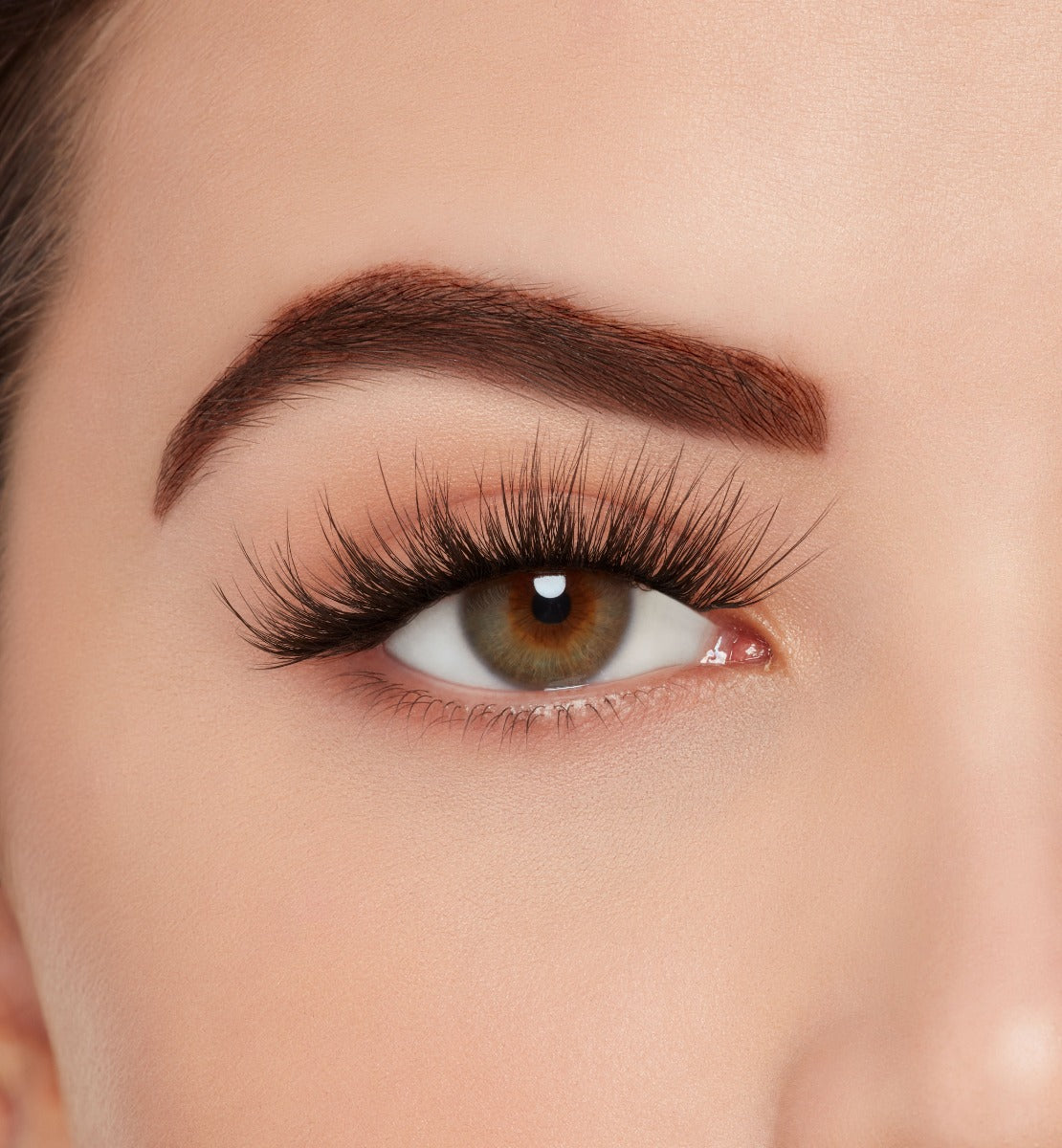 Close-up of a model's open right eye wearing Ardell Mega Volume 261 false eye lashes