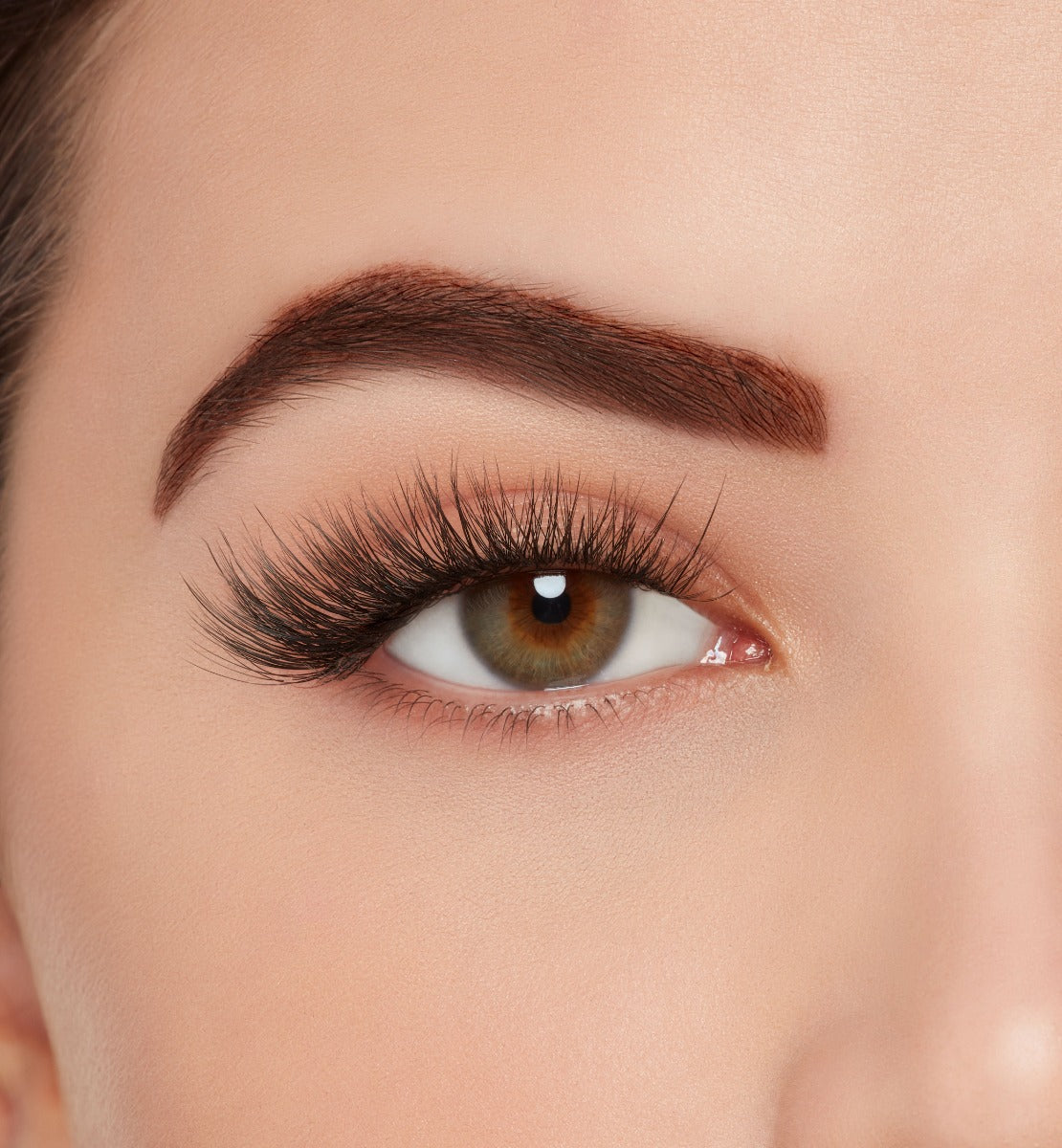Close-up of a model's open right eye wearing Ardell Mega Volume 262 false eye lashes