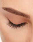Close-up of a model's closed right eye wearing an Ardell Lift Effect 740 faux lash