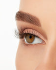 Angled shot of a model's open right eye wearing an Ardell Lift Effect 740 faux lash showing its light volume & medium length