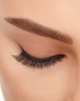 Close-up of a model's closed right eye wearing an Ardell Lift Effect 741 faux lash
