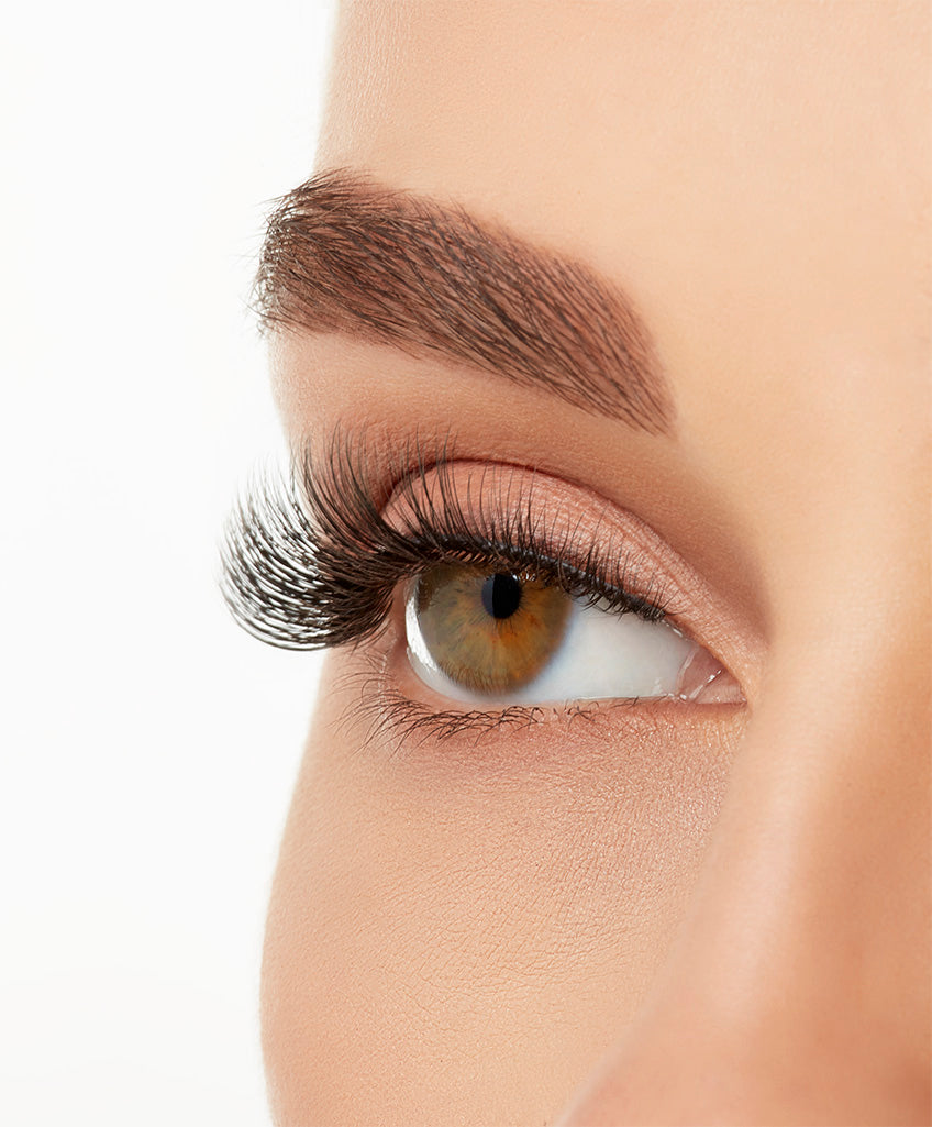 Angled close-up of a model's open right eye wearing an Ardell Lift Effect 741 faux lash