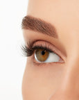 Angled close-up of a model's open right eye wearing an Ardell Lift Effect 742 faux lash