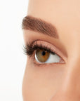 Angled close-up of a model's open right eye wearing an Ardell Lift Effect 743 faux lash