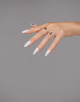 Hand with lilac almond-shaped nails, accessorized with rings, against a neutral background for a soft, feminine look.