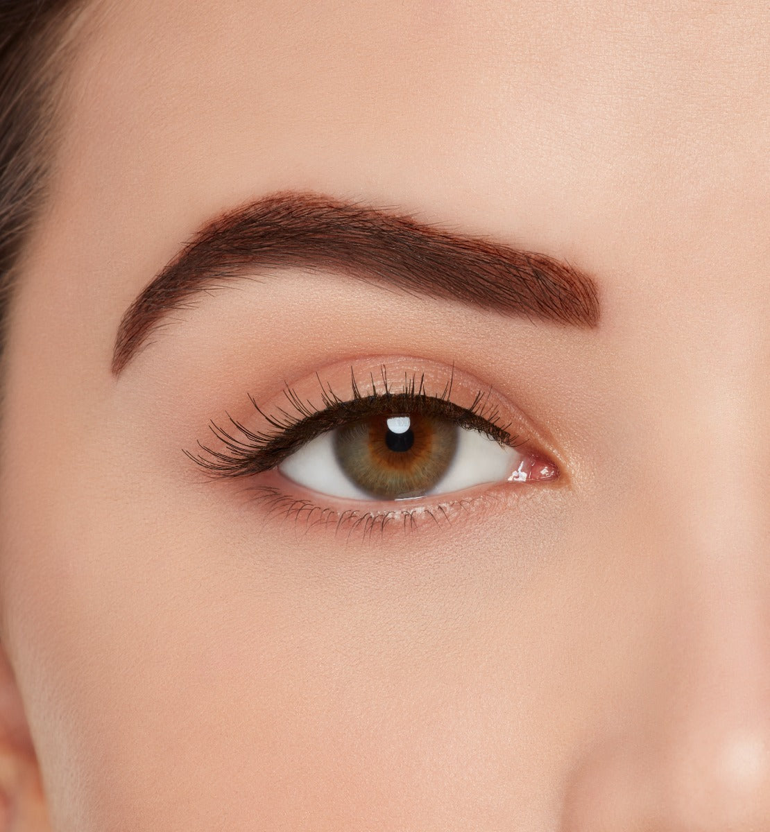 Front view of a model with wearing Ardell, X-tended Wear #110 lashes to show how they look on the eye