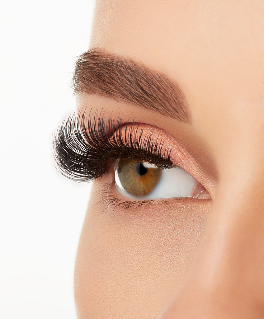 A model wearing Ardell Studio Effects 105 showing its enhanced winged effect, full volume, long length lash