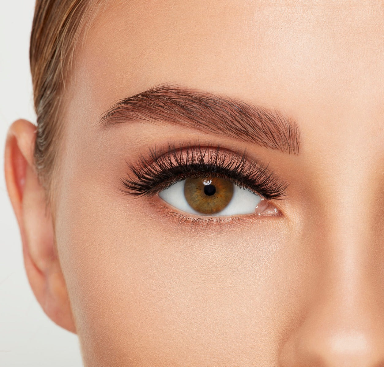 Closer look of a model's open right eye wearing an Ardell Mega Volume 252 false lash