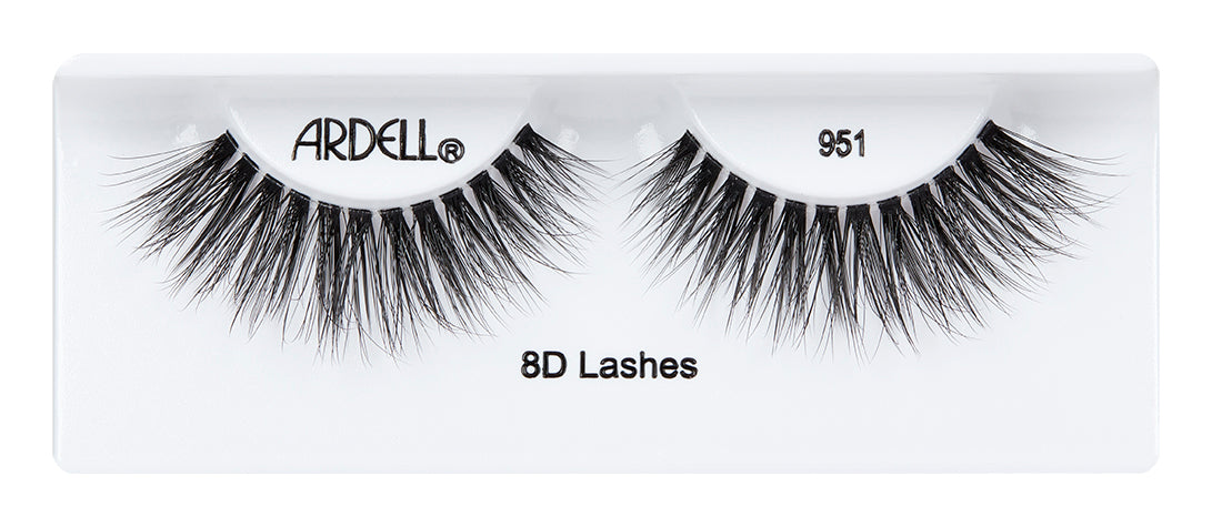 A pair of Ardell 8D Lash 951 placed into its inner plastic packaging with some texts written on it