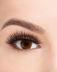 A model wearing Ardell's Faux mink 817 with open right eye showing its flared, winged-out & natural lash look