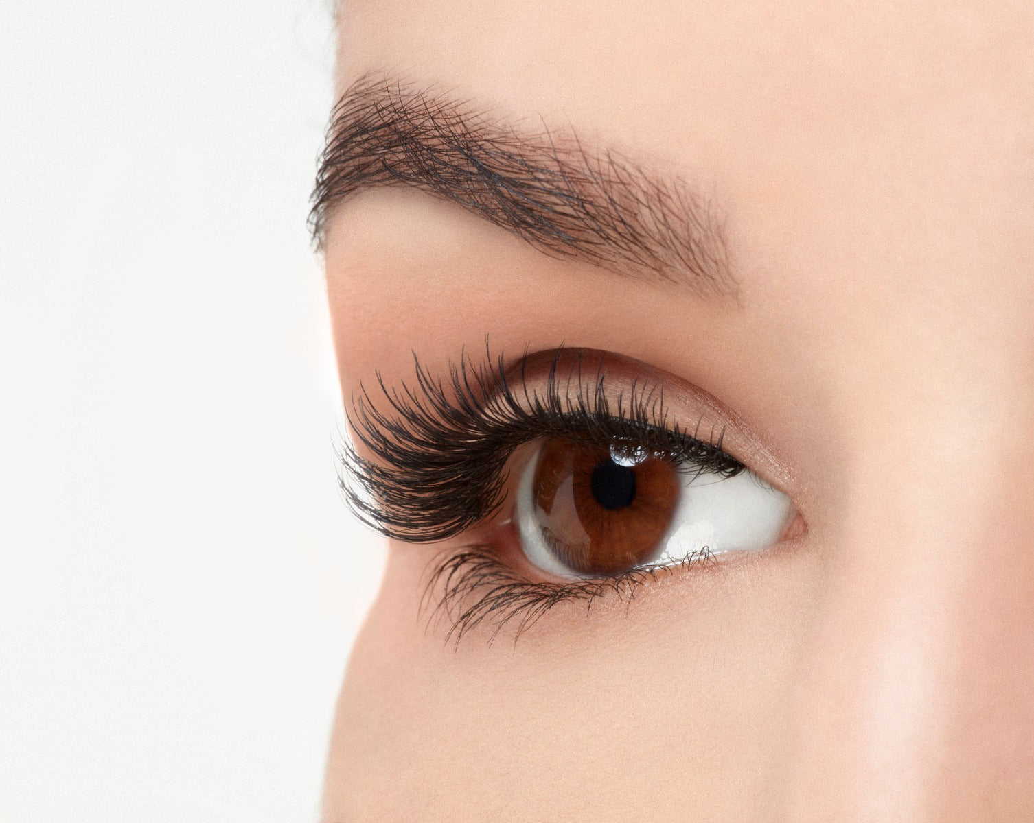 Closer look of a model's open right eye wearing an Ardell Natural 174 eyelashes