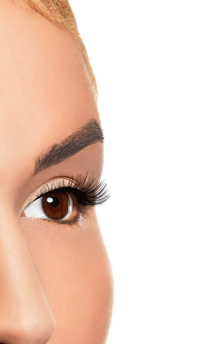 Model shot of eye to angle wearing Winks Half & Half Pre-Cut Lashes Dream