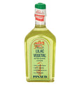 A clear 6-ounce bottle of Clubman Pinaud After Shave Lotion Lilac Vegetal showing its herbal green colored liquid contents