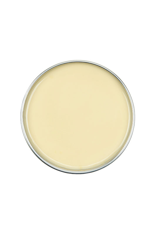 Top view of an open can of GiGi All Purpose Hard Wax showing its creamy white color