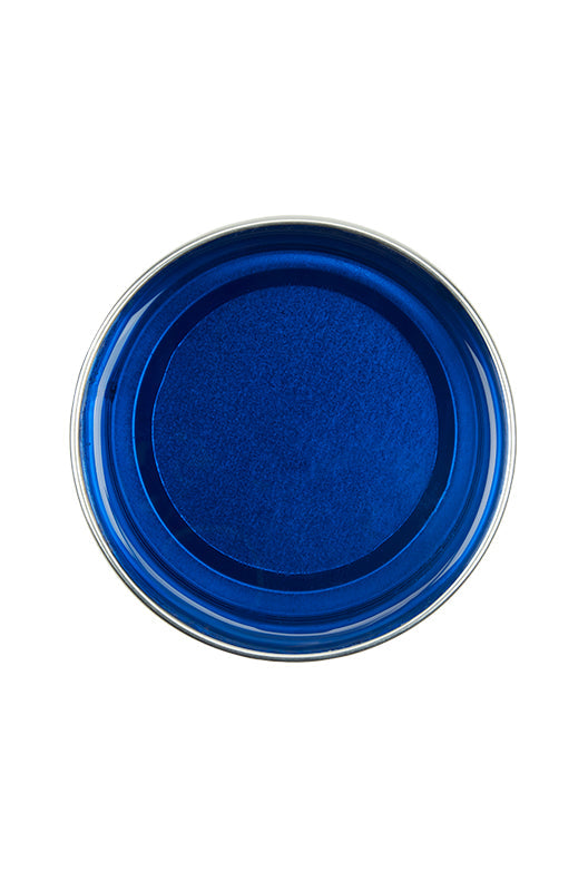 Top view of an open can of GiGi Azulene Infused Wax showing melted blue translucent wax