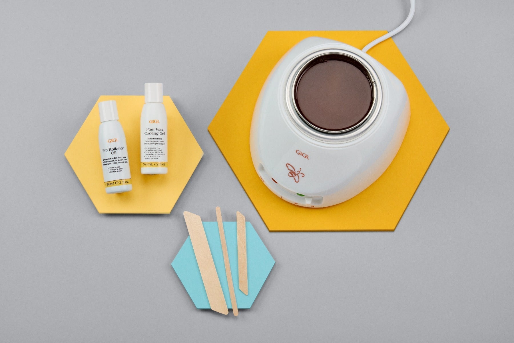 Professional-Grade Wax Warmer, Pre Epilation Oil, Post Wax Cooling Gel, 1 Petite Applicator, 1 Small Accu Edge Applicator, 1 Large Accu Edge Applicator displaced outside packaging