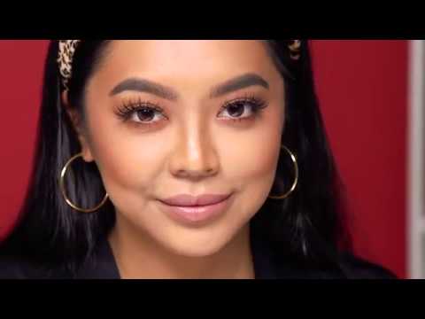 Model Wearing Ardell Lashes & Brows ƒ?? Woman with voluminous false lashes and defined brows using Ardell products.