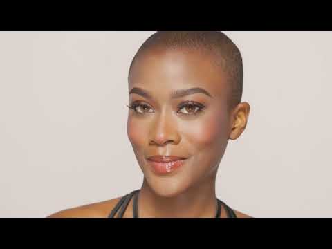 A radiant model showcasing a flawless makeup look using Ardell beauty products for a glowing finish.