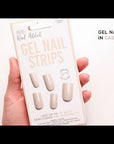 Gel nail strips in Cashmere Sands shade, semi-cured for long-lasting wear, in packaging.