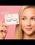 A smiling model showcasing Ardell Naked Lashes, demonstrating their seamless and natural appearance.