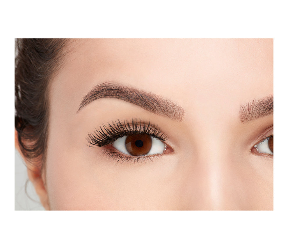 A model with opened eye wearing Ardell Fauxmink Demi Wispies showing how it looks like when worn on a frontal view