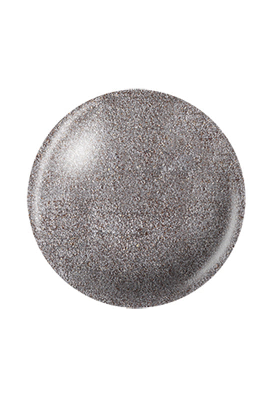 A shimmering silver color of a round shape nail lacquer sample color swatch drop in white background