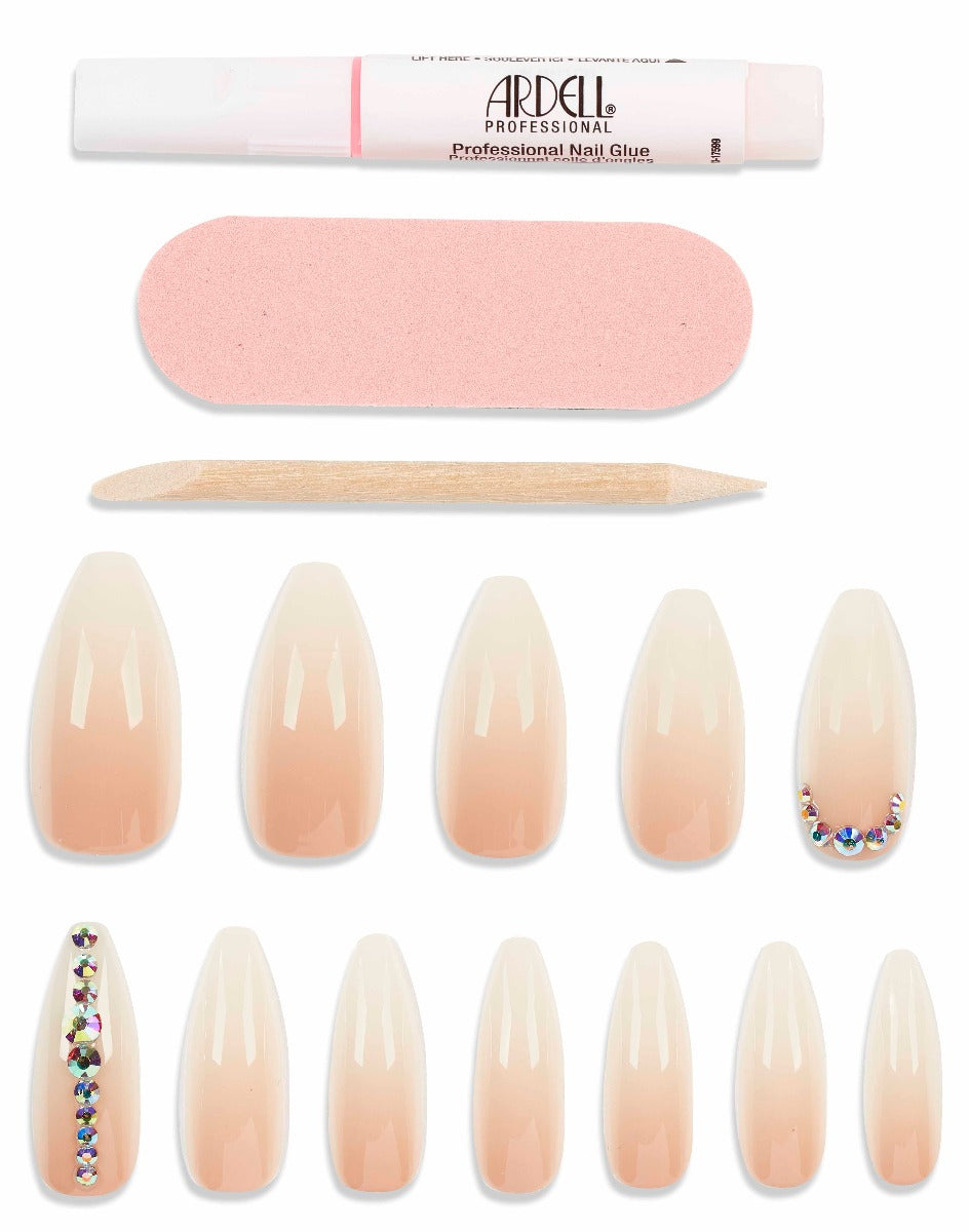 Nude gradient press-on nails with rhinestone accents, includes glue, file, and cuticle stick for easy salon-quality application.